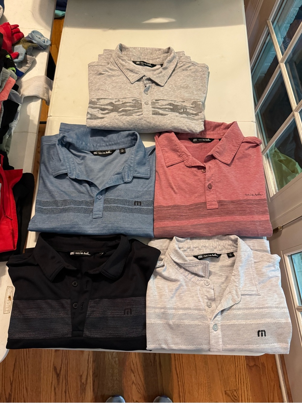 Lot of Travis Mathew golf polos